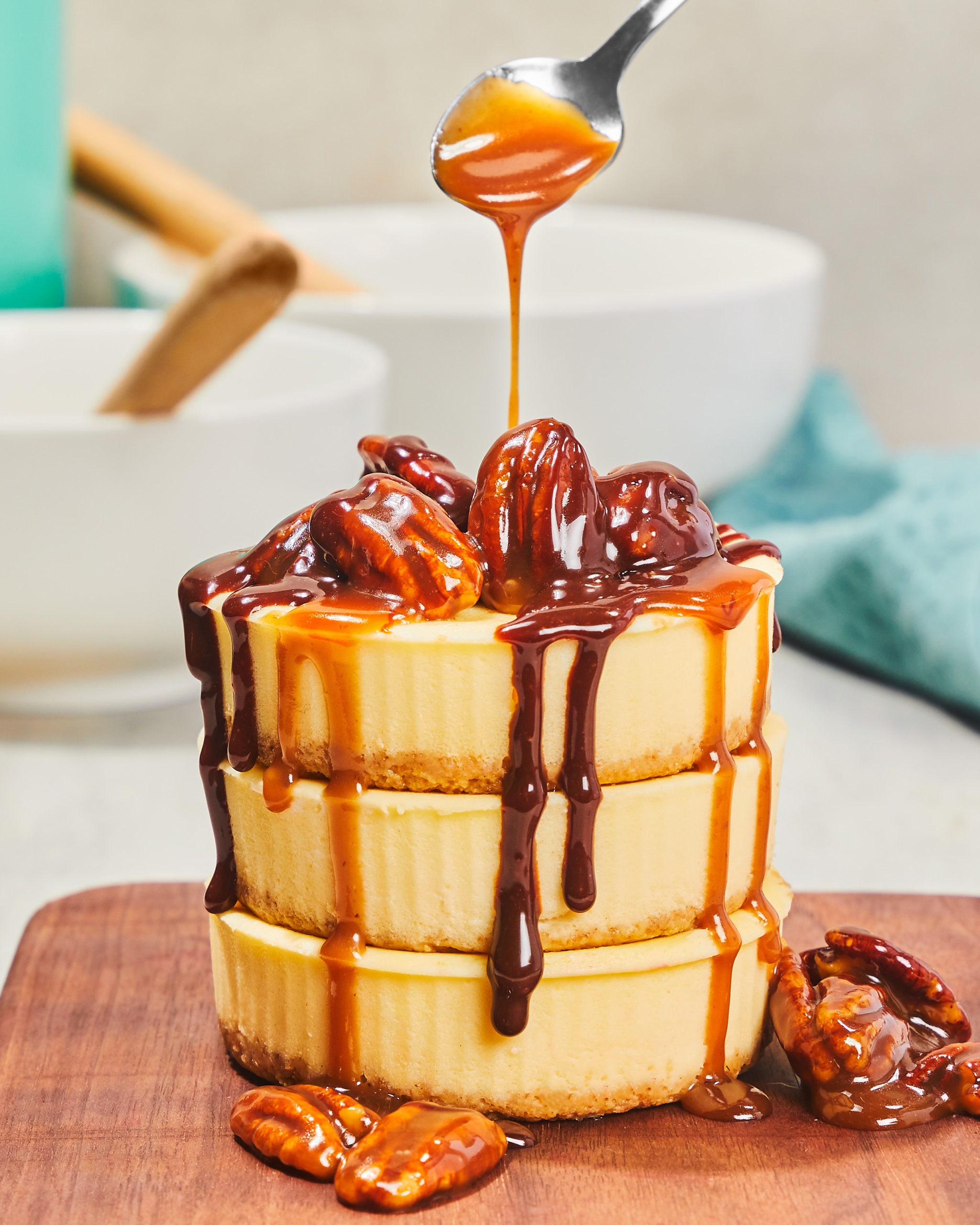 Mini cheesecakes drizzled with caramel and pecans