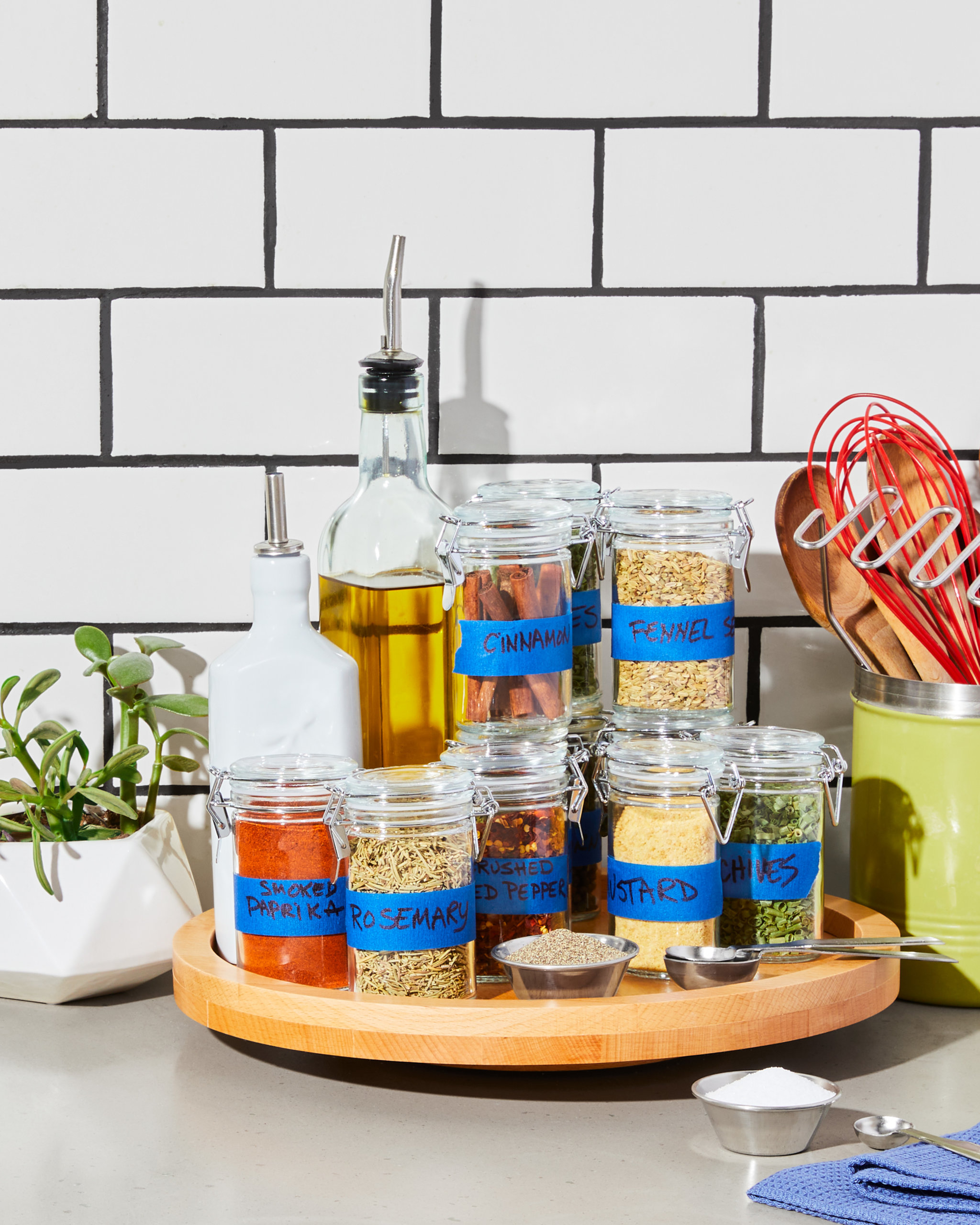 Organize Your Spice Cabinet with labels and a spice caddy
